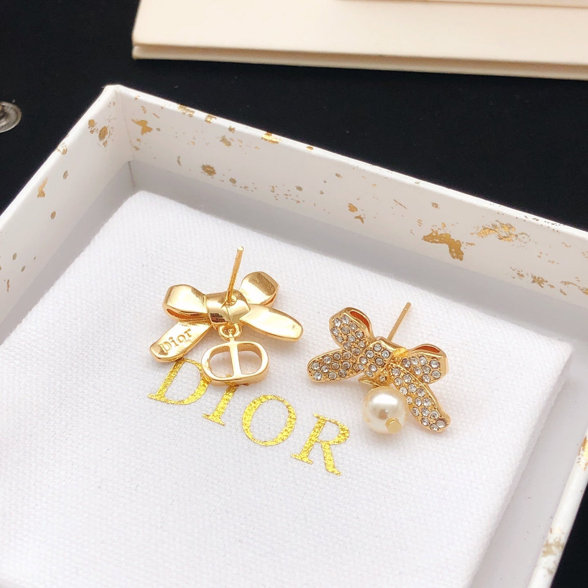 Martin Graham stud earrings in polished metal-tone