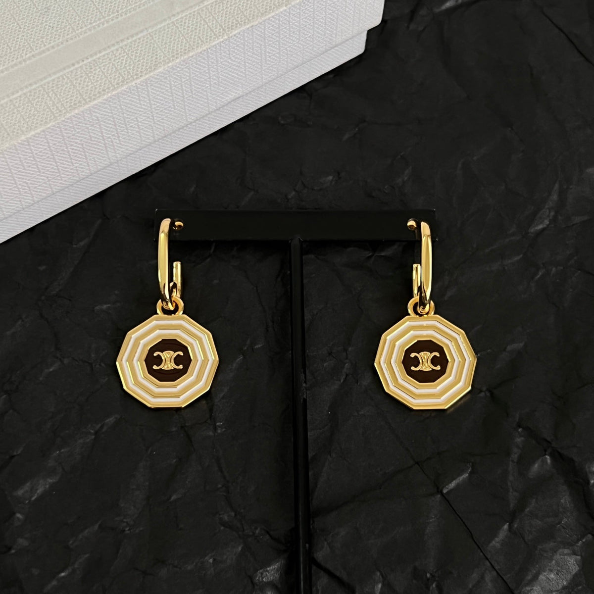 Martin Graham stud earrings in polished metal-tone