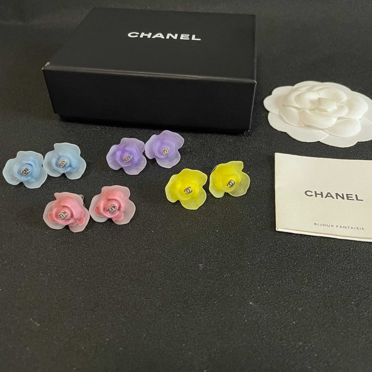 Martin Graham stud earrings in polished metal-tone – close-up detail