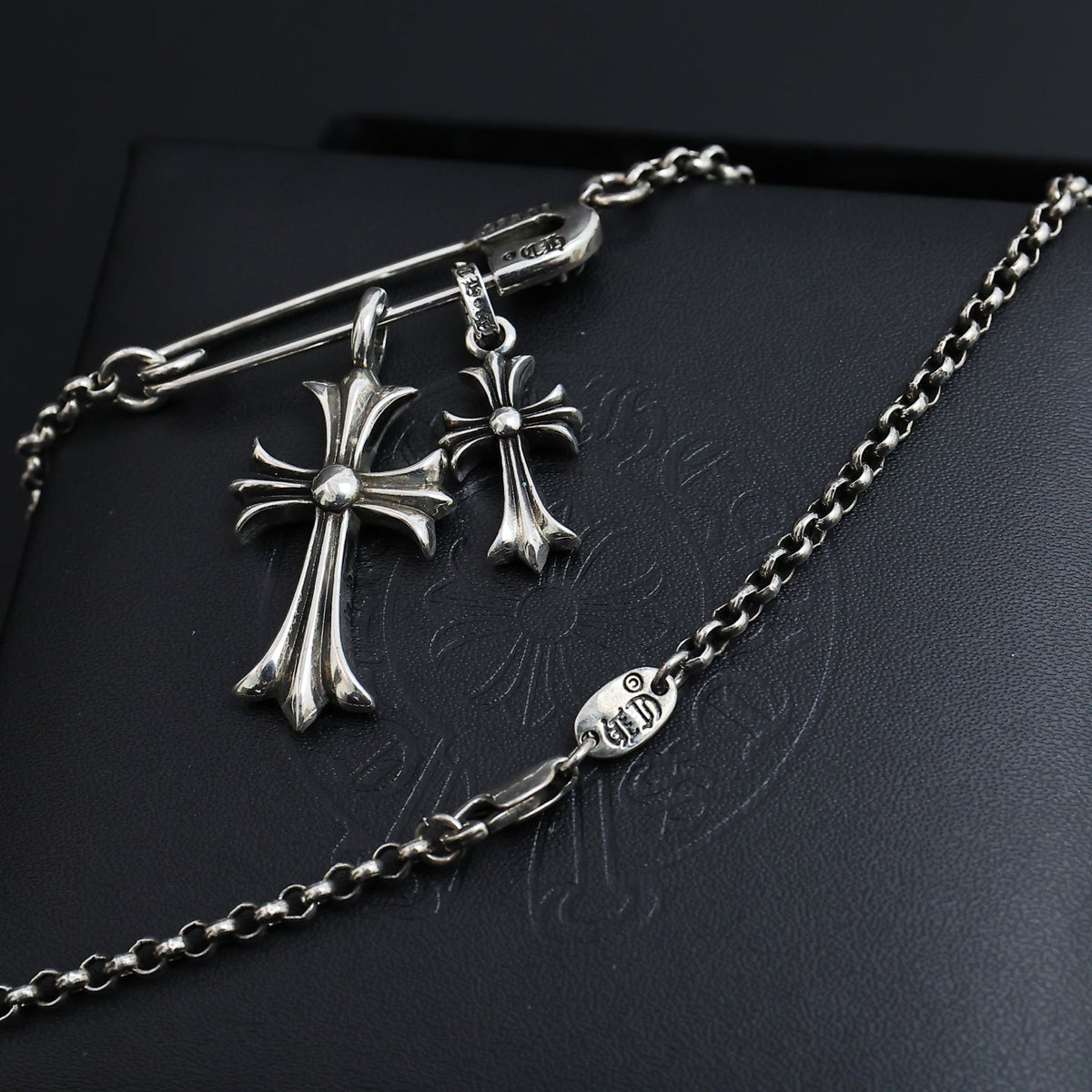Martin Graham pendant necklace in polished metal-tone – close-up detail