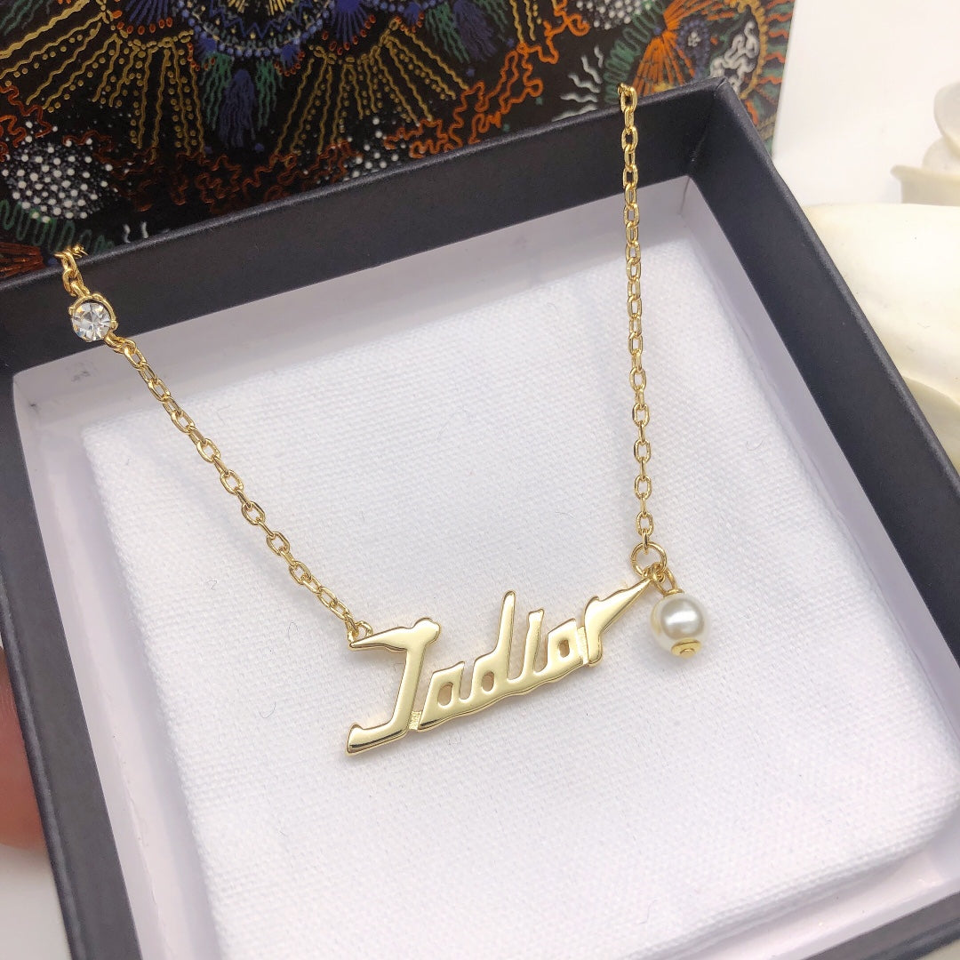 Martin Graham pendant necklace in polished metal-tone