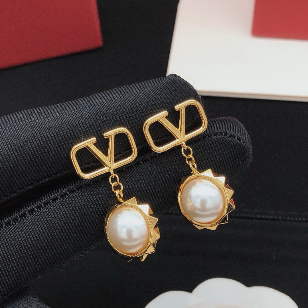 Martin Graham stud earrings in polished metal-tone