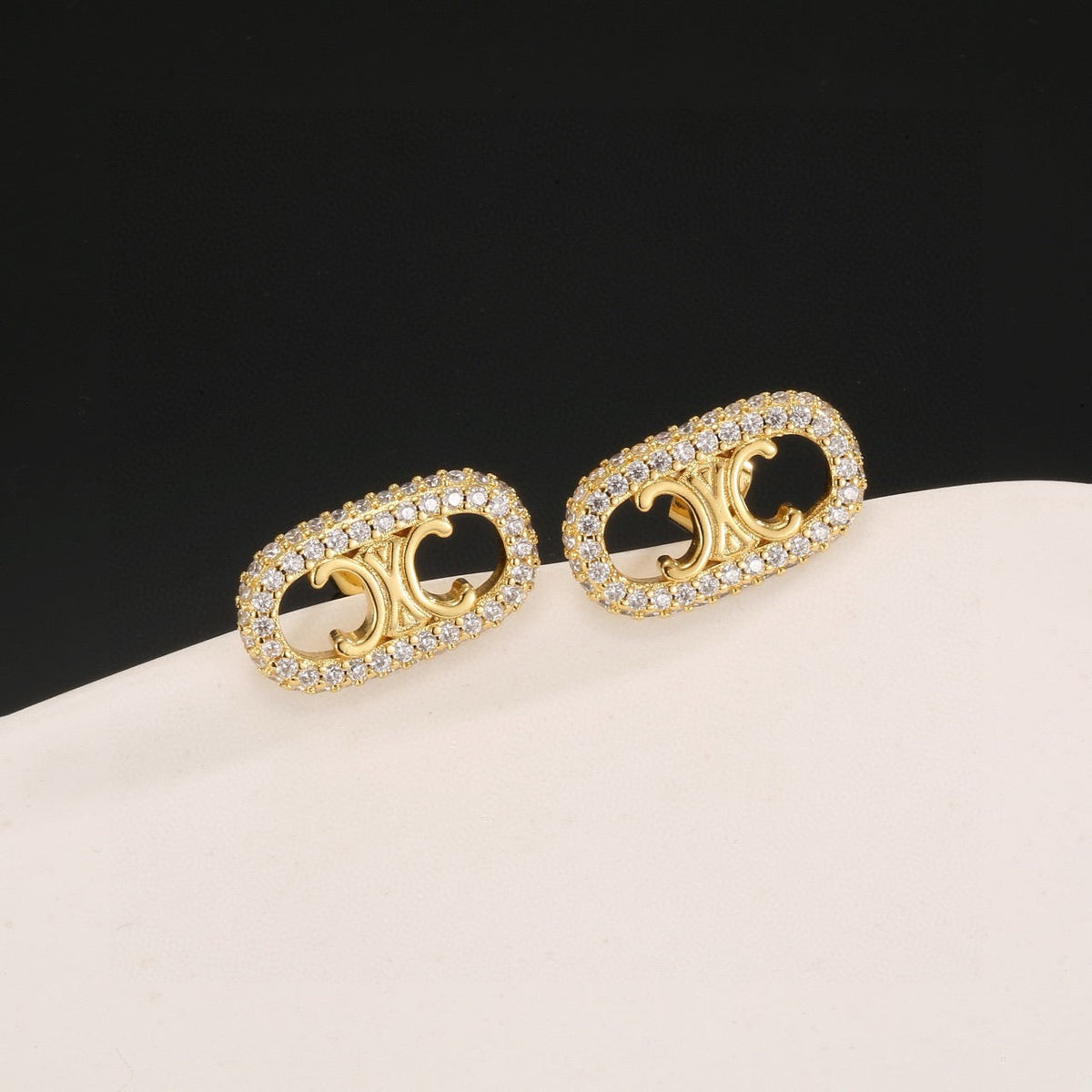 Martin Graham stud earrings in polished metal-tone
