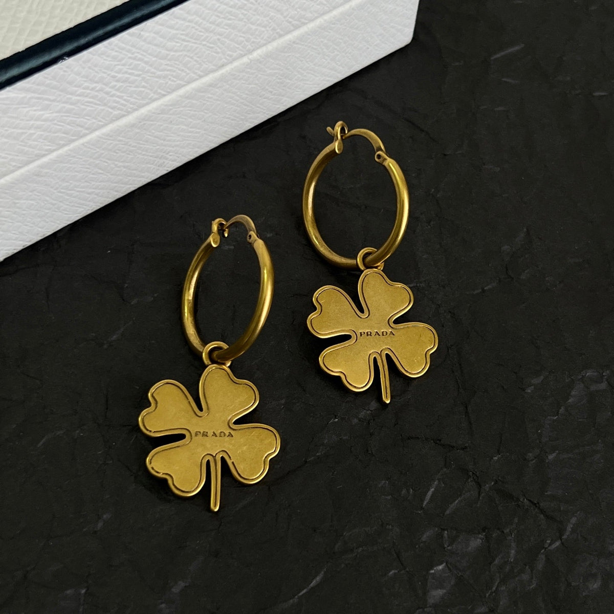 Martin Graham earrings in polished metal-tone