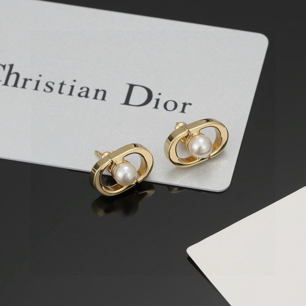 Martin Graham stud earrings in polished metal-tone