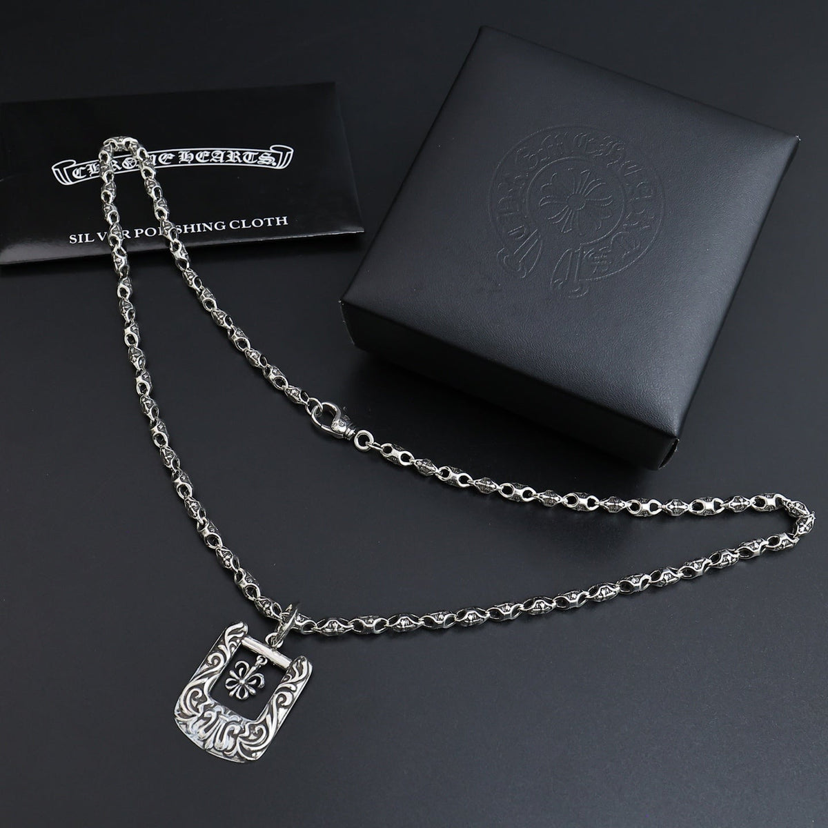 Martin Graham pendant necklace in polished metal-tone – close-up detail