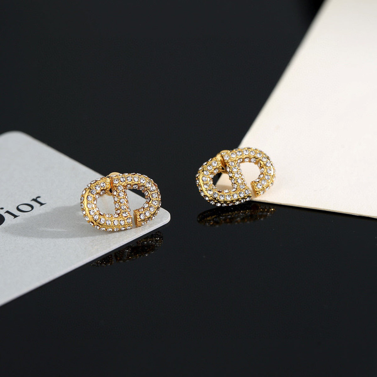 Martin Graham stud earrings in polished metal-tone