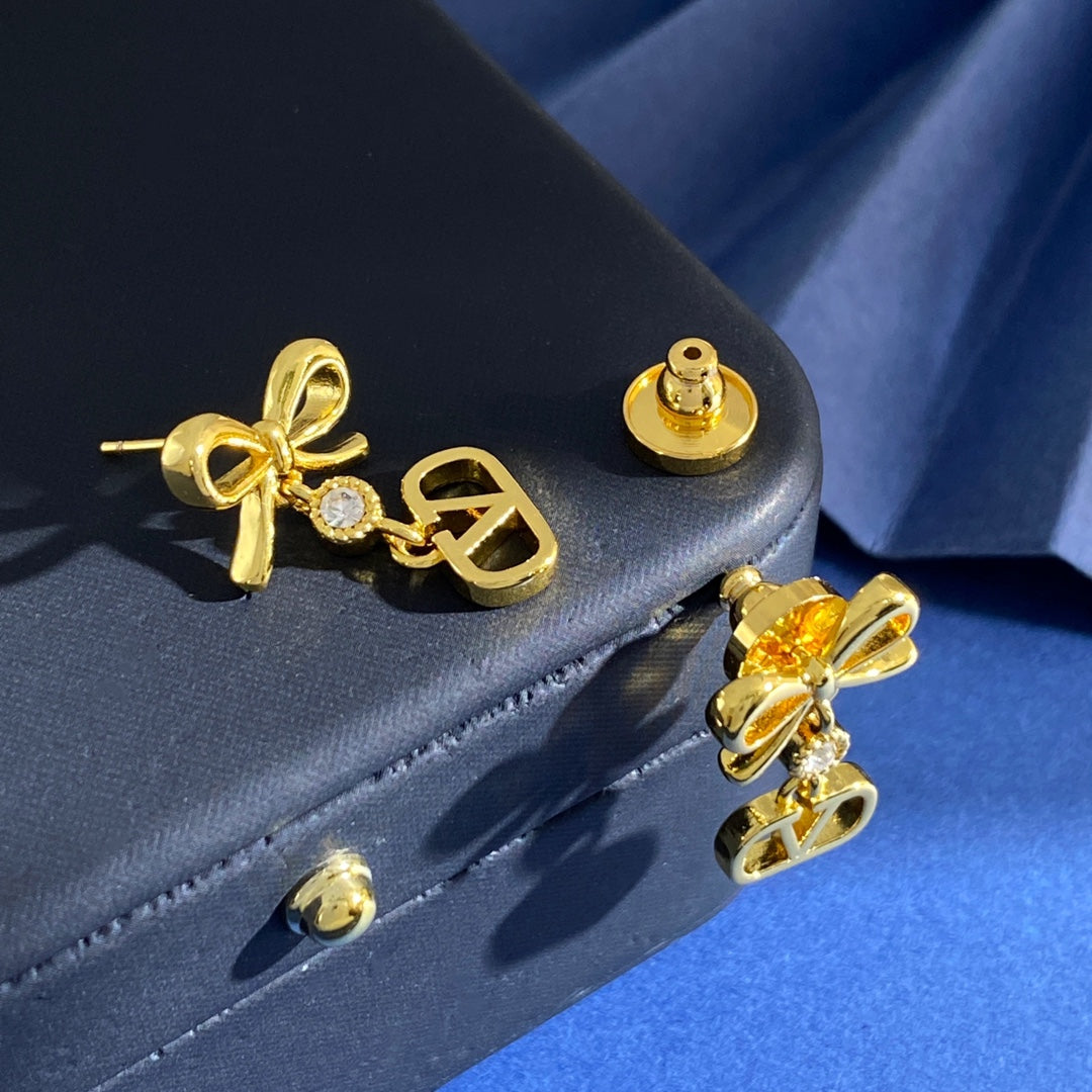 Martin Graham stud earrings in polished metal-tone