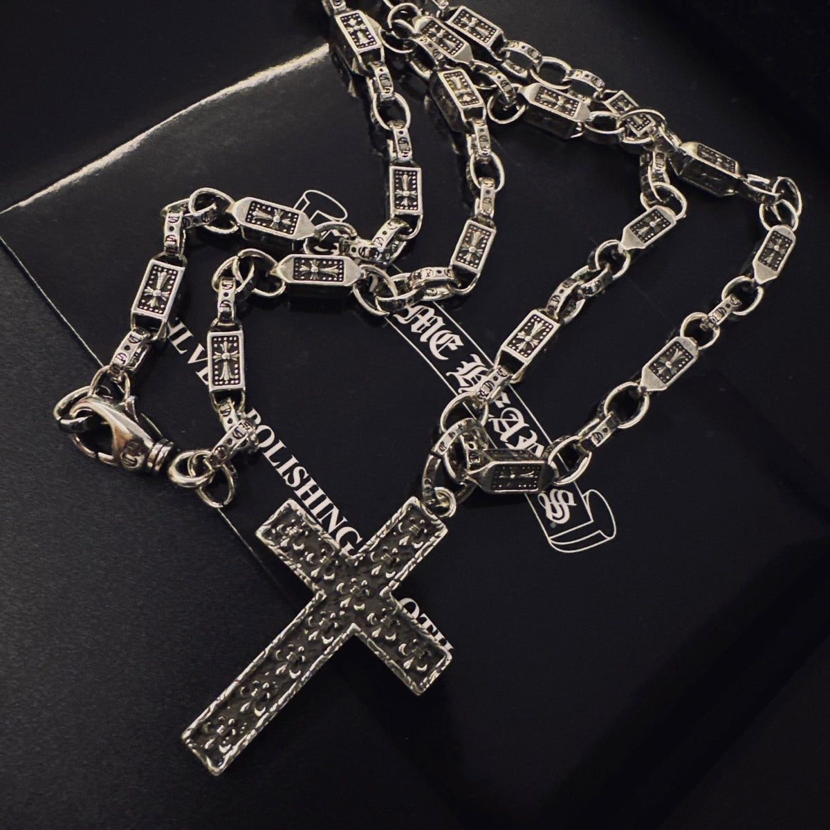 Martin Graham pendant necklace in polished metal-tone – close-up detail