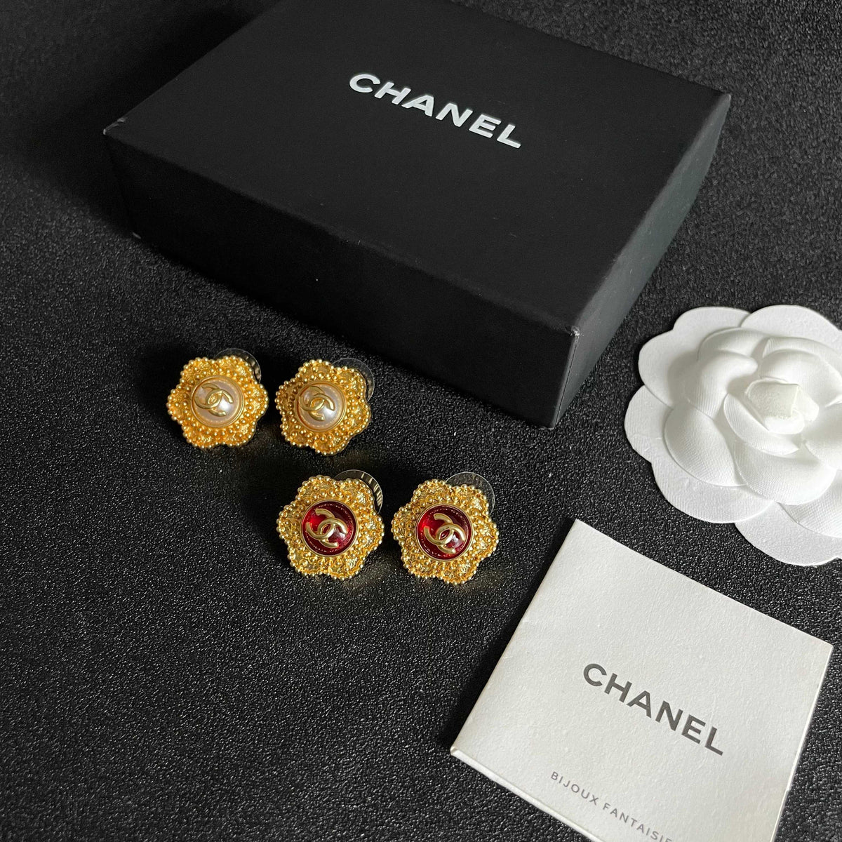 Martin Graham stud earrings in polished metal-tone – close-up detail