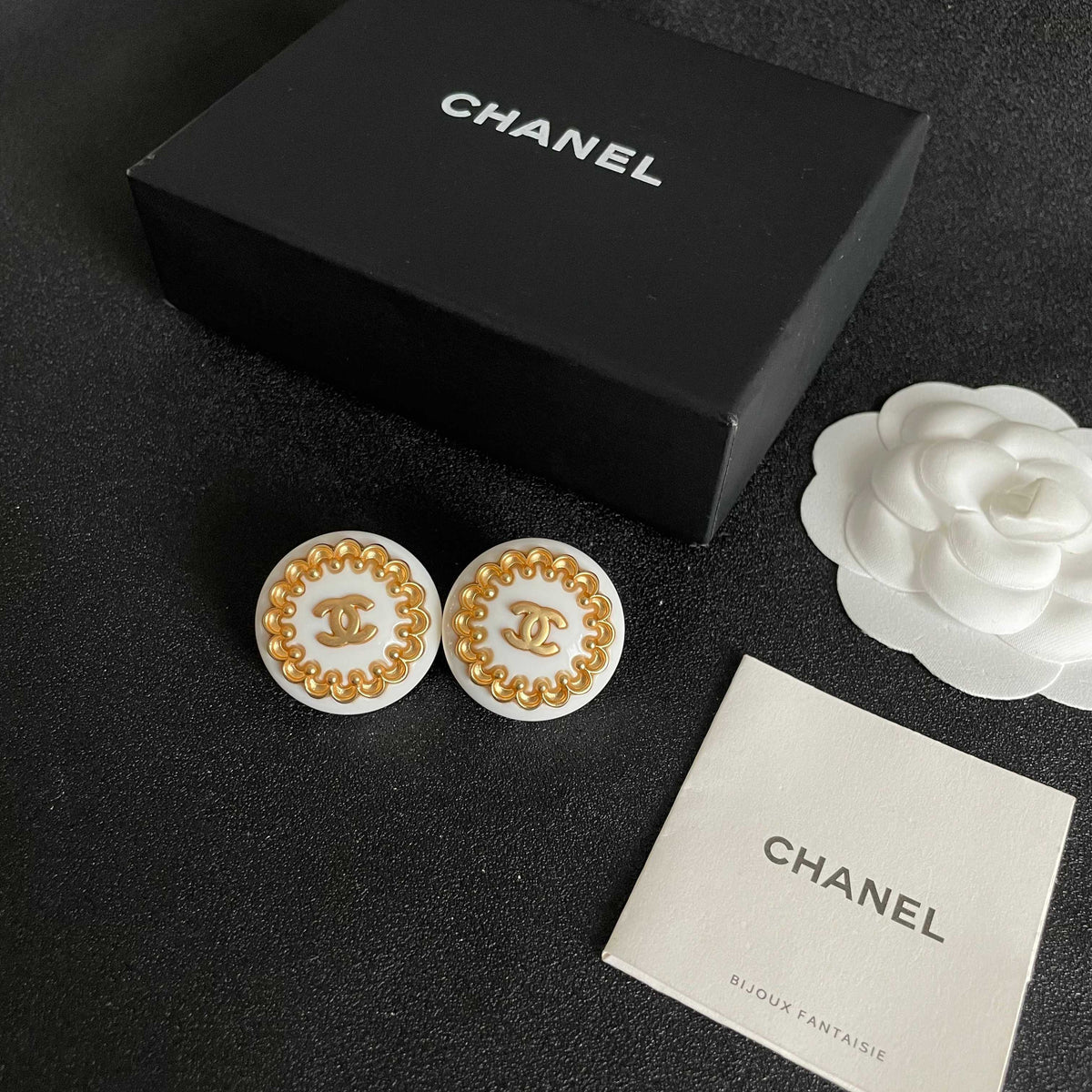 Martin Graham stud earrings in polished metal-tone – close-up detail