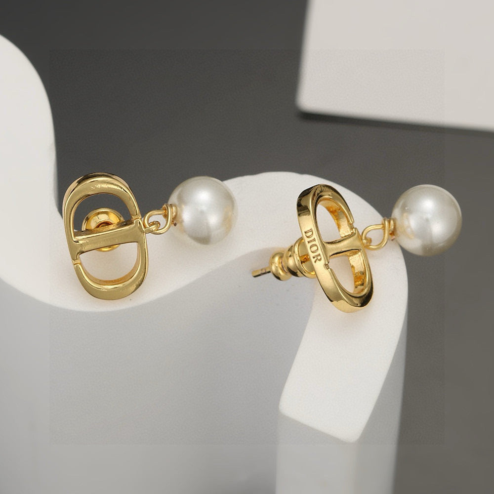 Martin Graham stud earrings in polished metal-tone