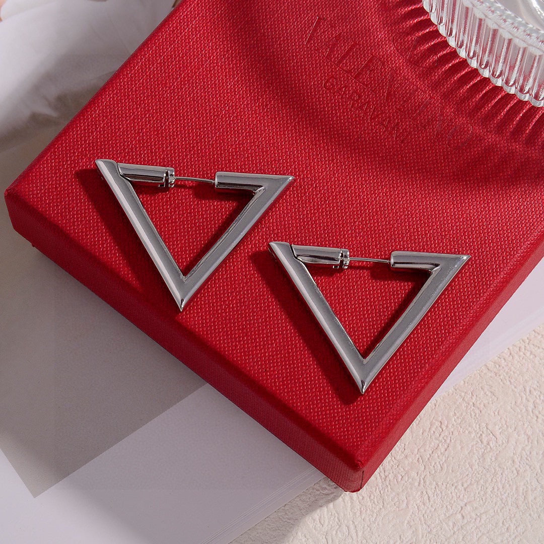 Martin Graham stud earrings in polished metal-tone