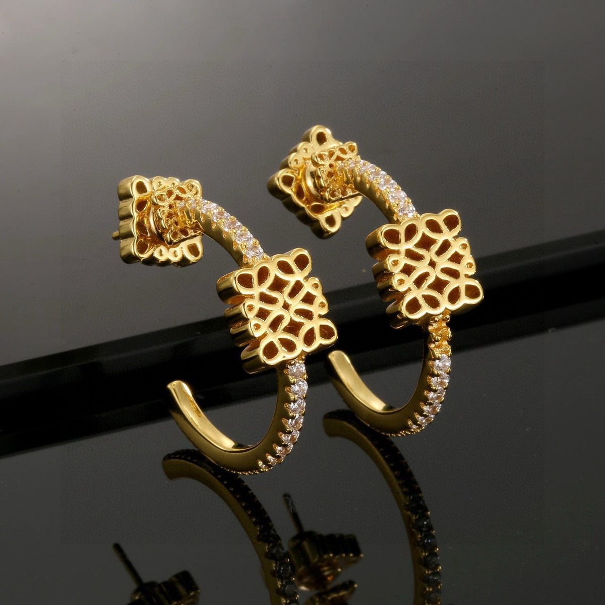 Martin Graham stud earrings in polished metal-tone