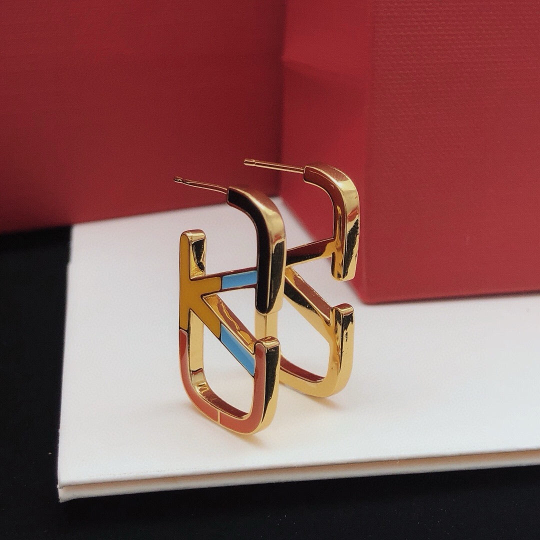 Martin Graham stud earrings in polished metal-tone
