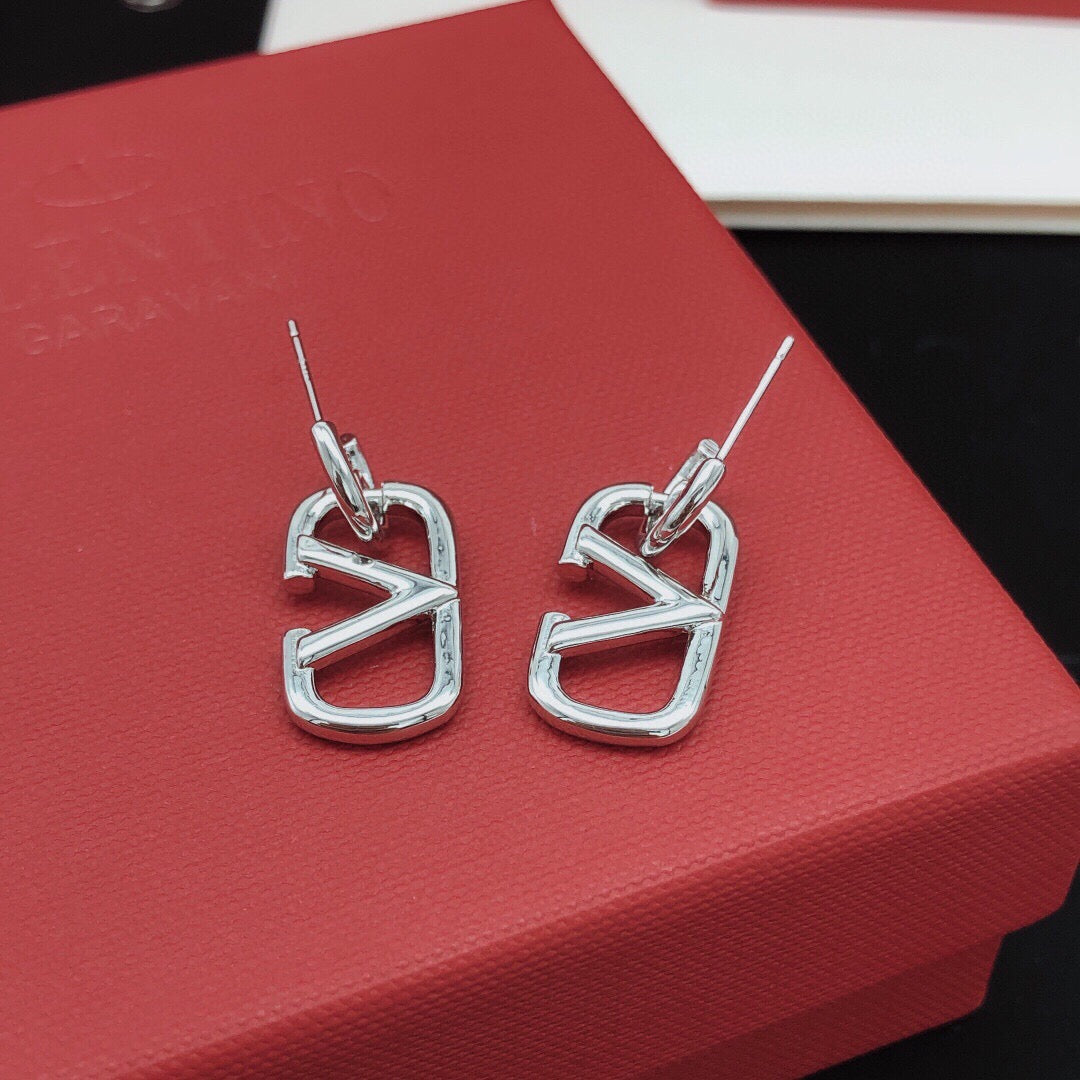 Martin Graham drop earrings in polished metal-tone