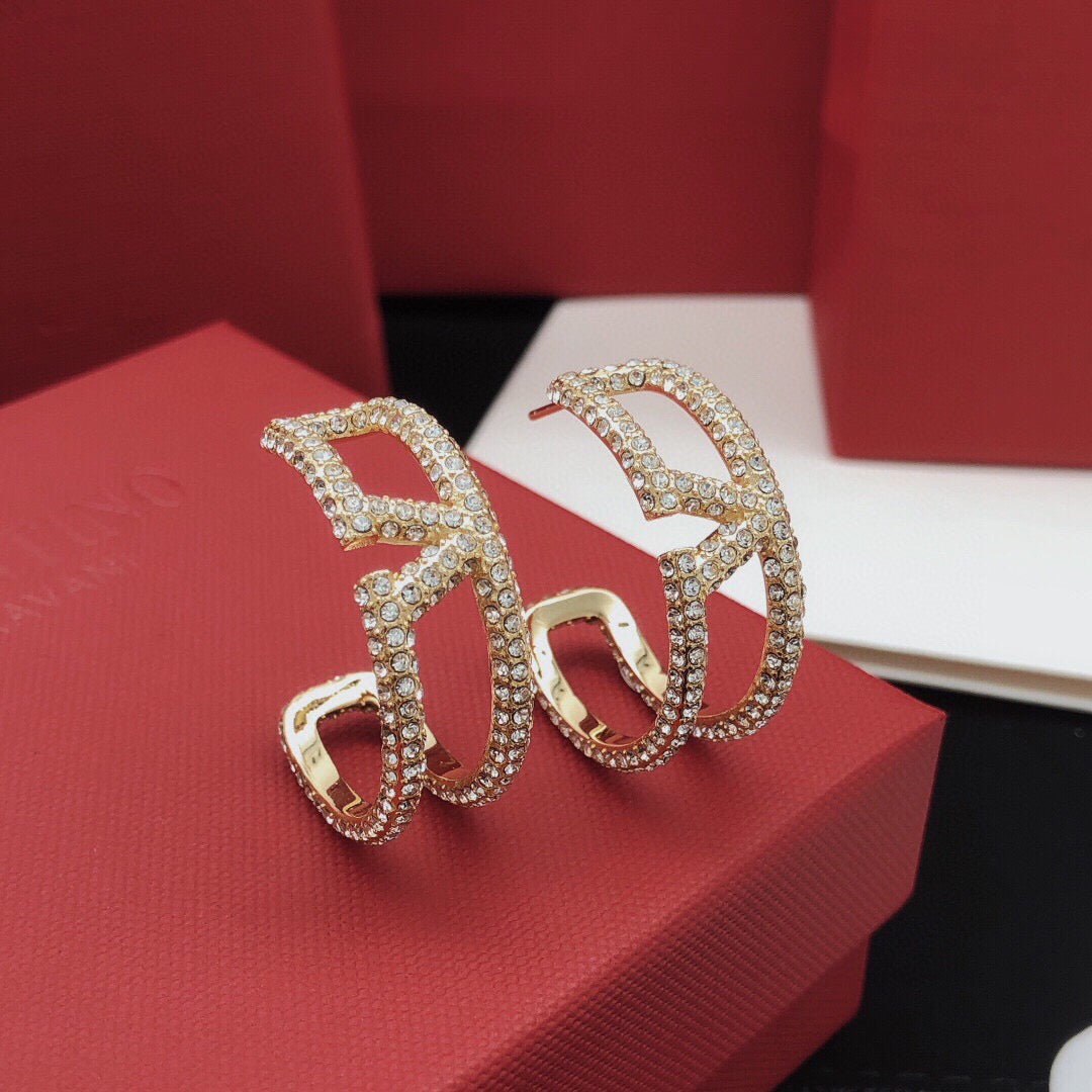 Martin Graham earrings in polished metal-tone