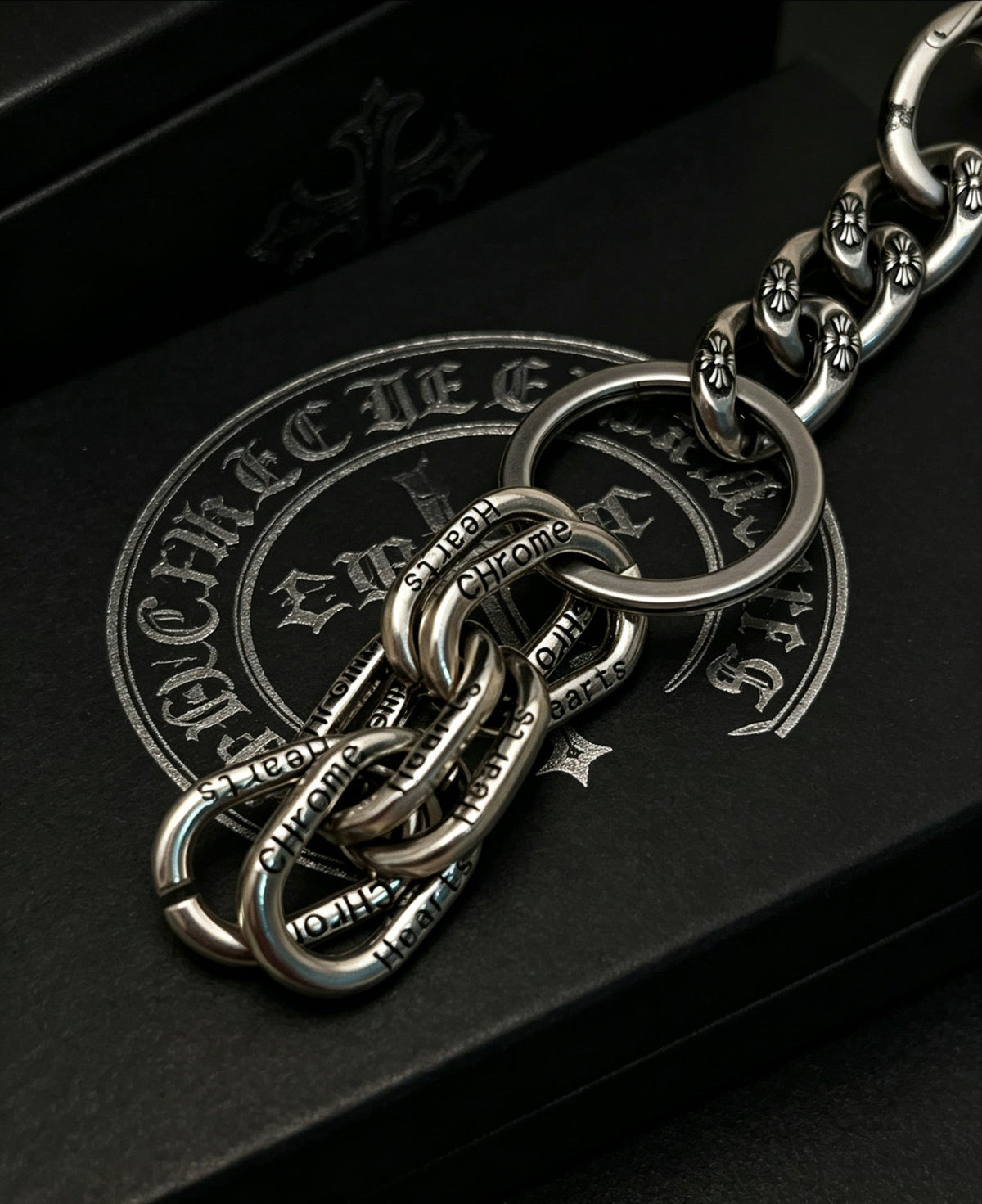 Martin Graham chain accessory in polished metal-tone – close-up detail