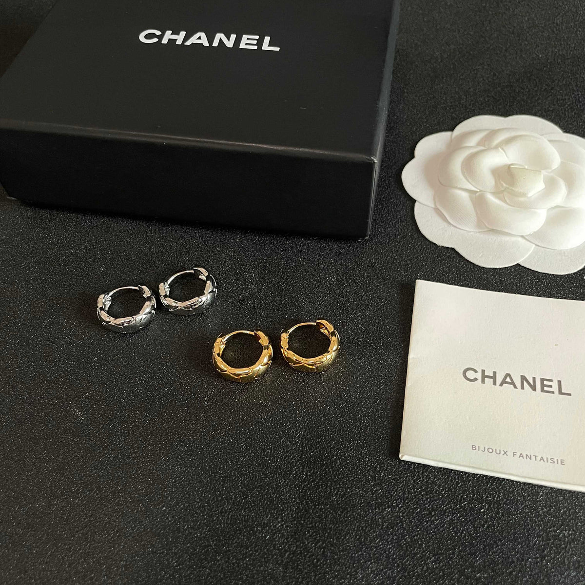 Martin Graham stud earrings in polished metal-tone – close-up detail