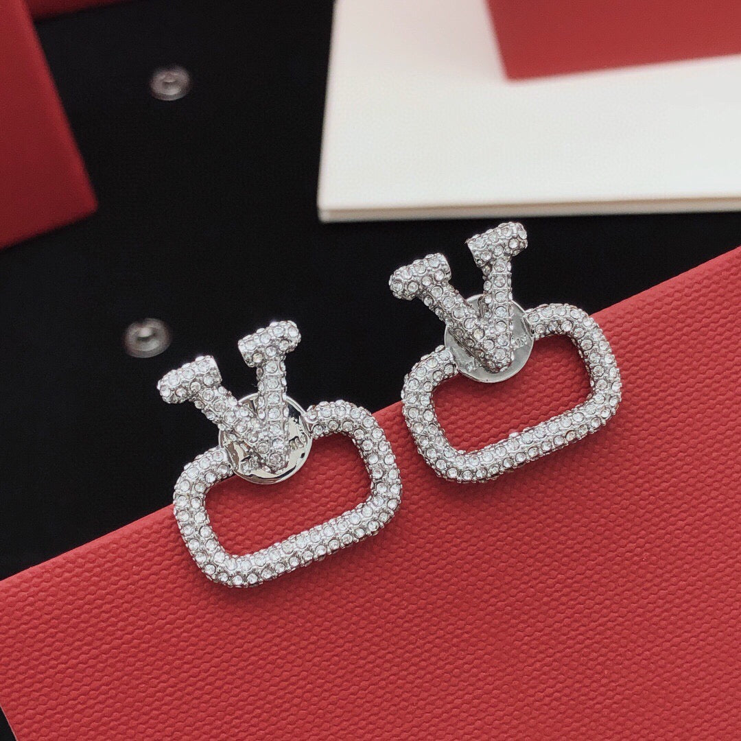 Martin Graham stud earrings in polished metal-tone