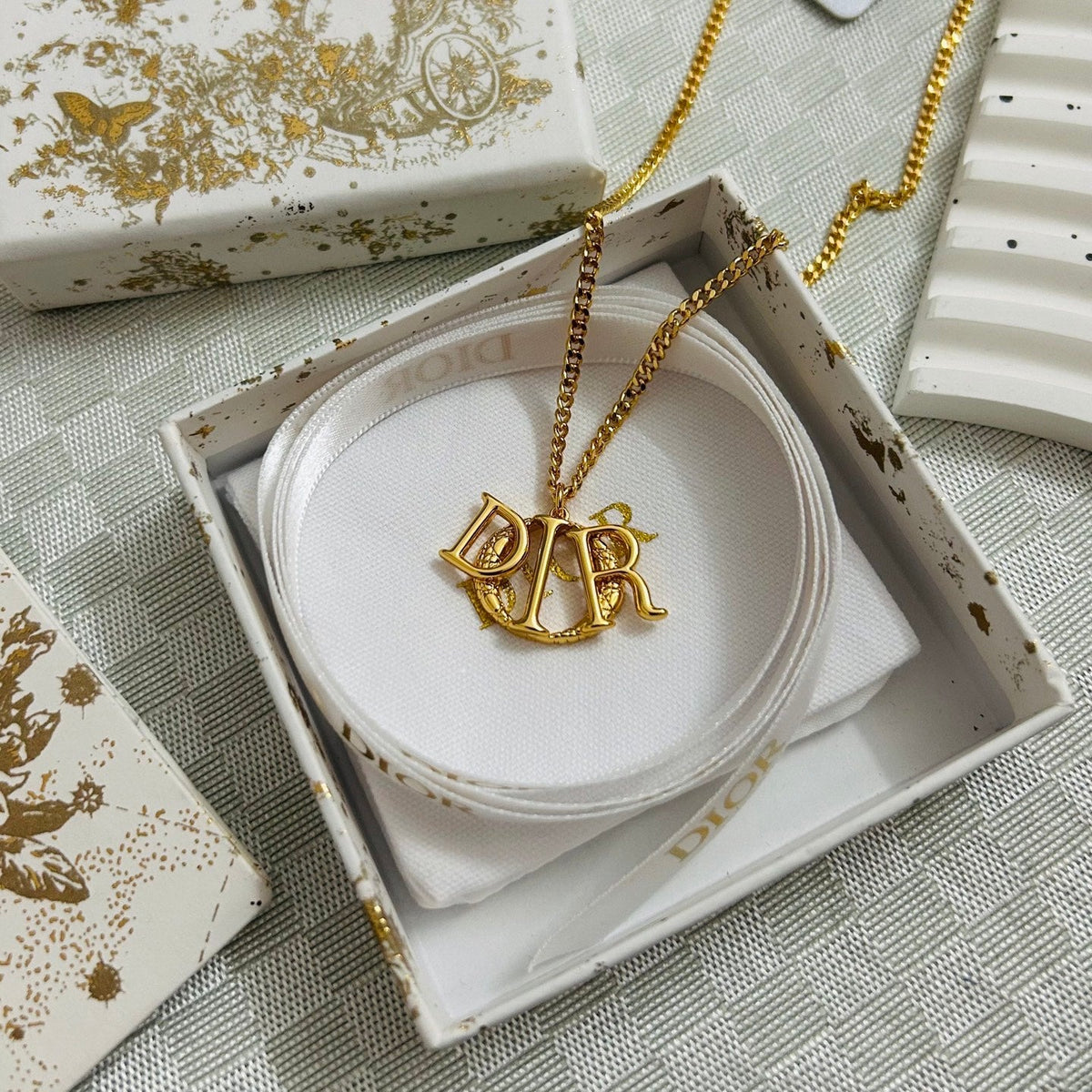 Martin Graham pendant necklace in polished metal-tone