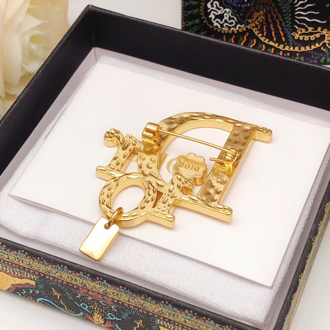 Martin Graham brooch in polished metal-tone