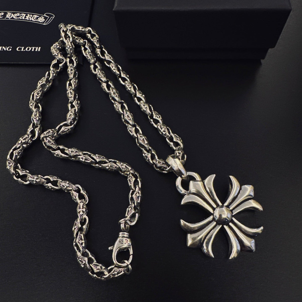 Martin Graham pendant necklace in polished metal-tone – close-up detail