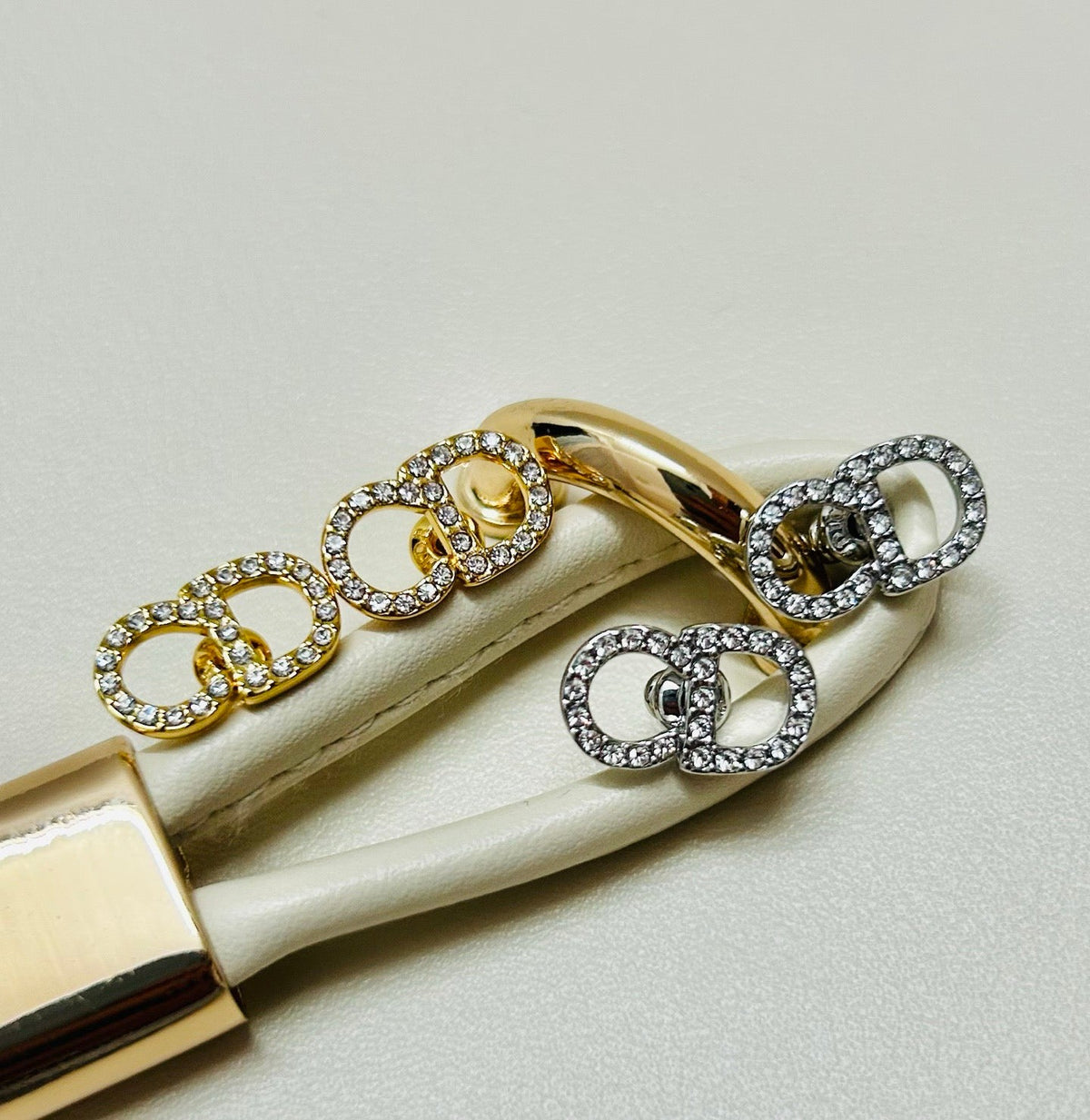 Martin Graham earrings in polished metal-tone