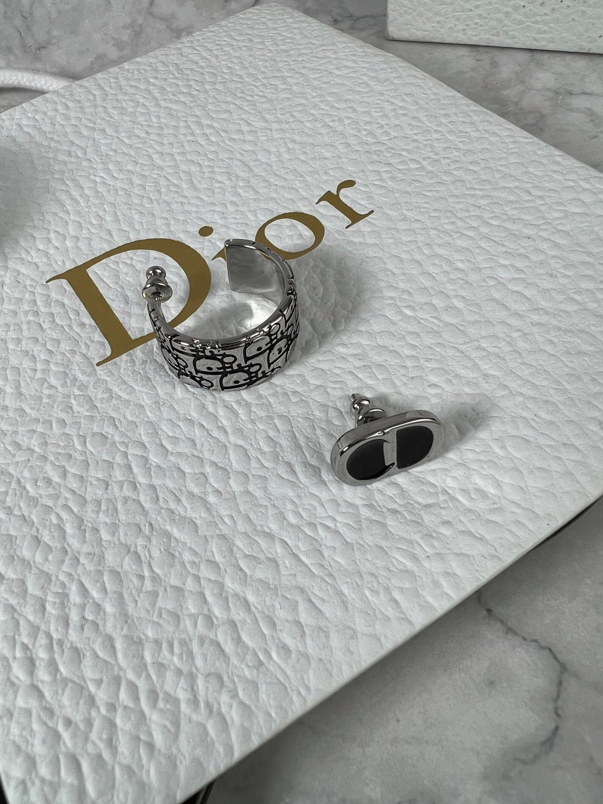 Martin Graham stud earrings in polished metal-tone