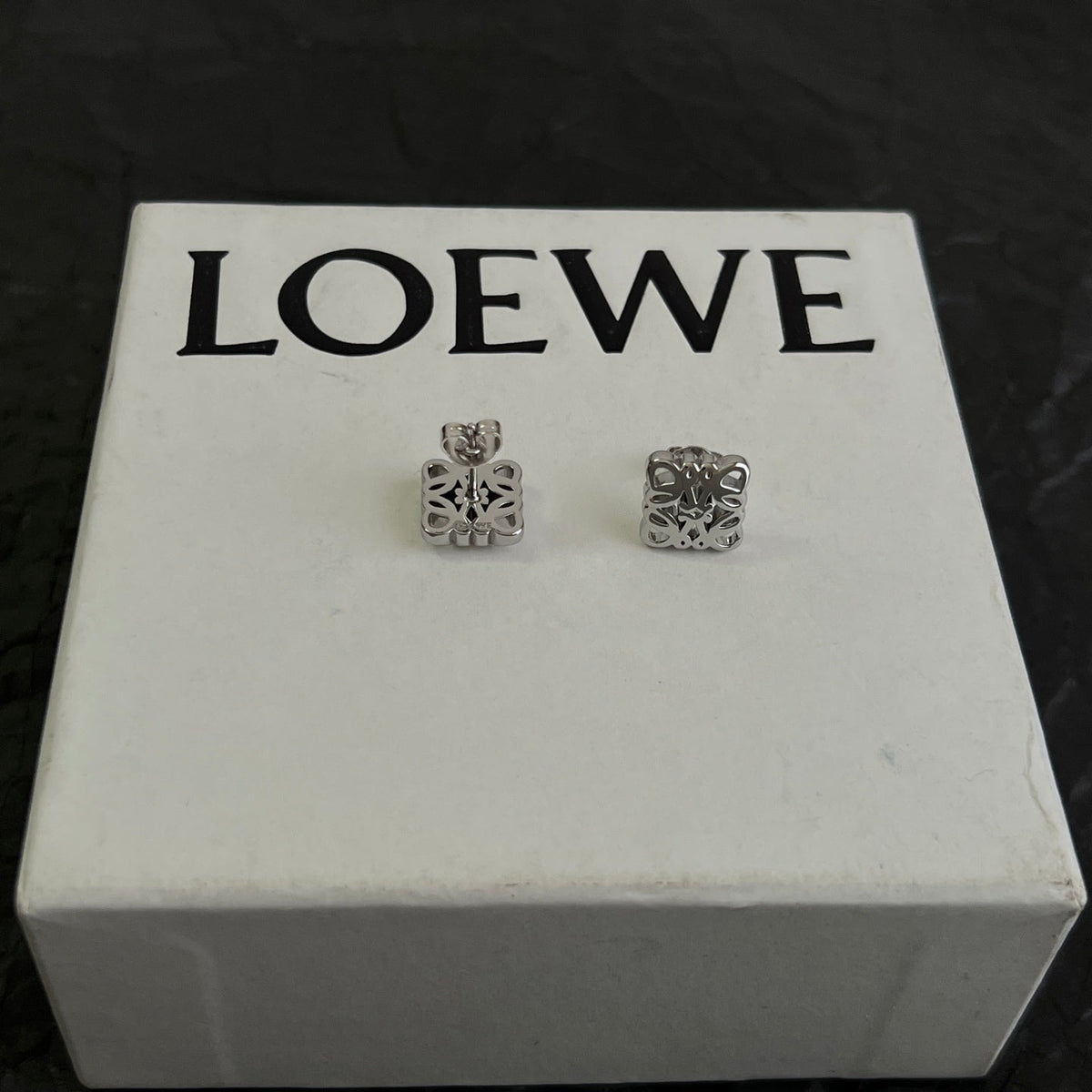 Martin Graham stud earrings in polished metal-tone
