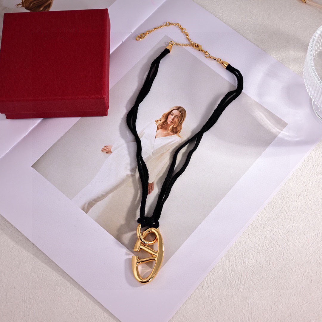 Martin Graham pendant necklace in polished metal-tone