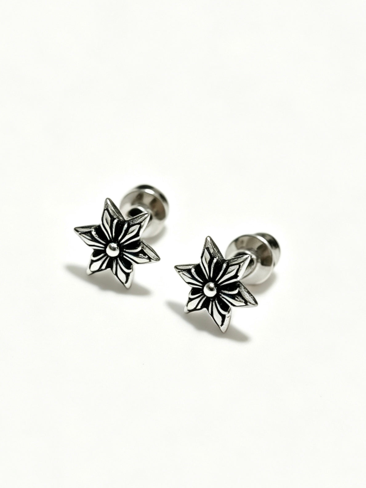 Martin Graham earrings in polished metal-tone – close-up detail