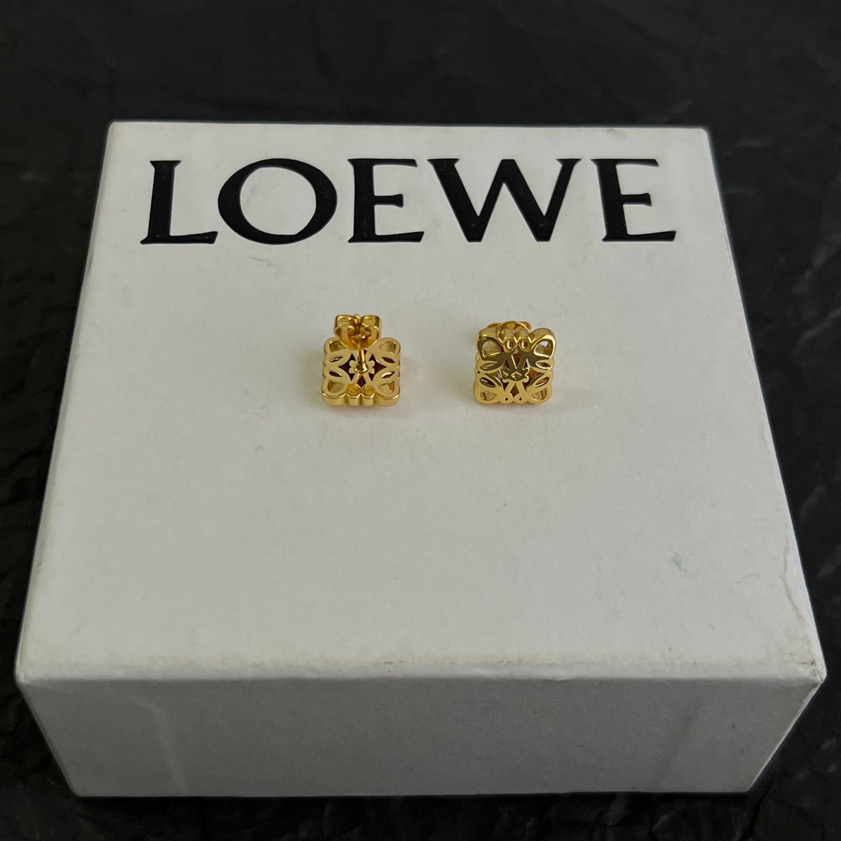 Martin Graham stud earrings in polished metal-tone