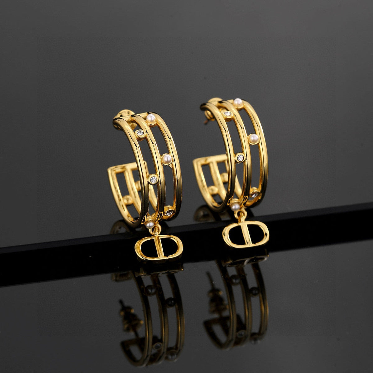 Martin Graham stud earrings in polished metal-tone