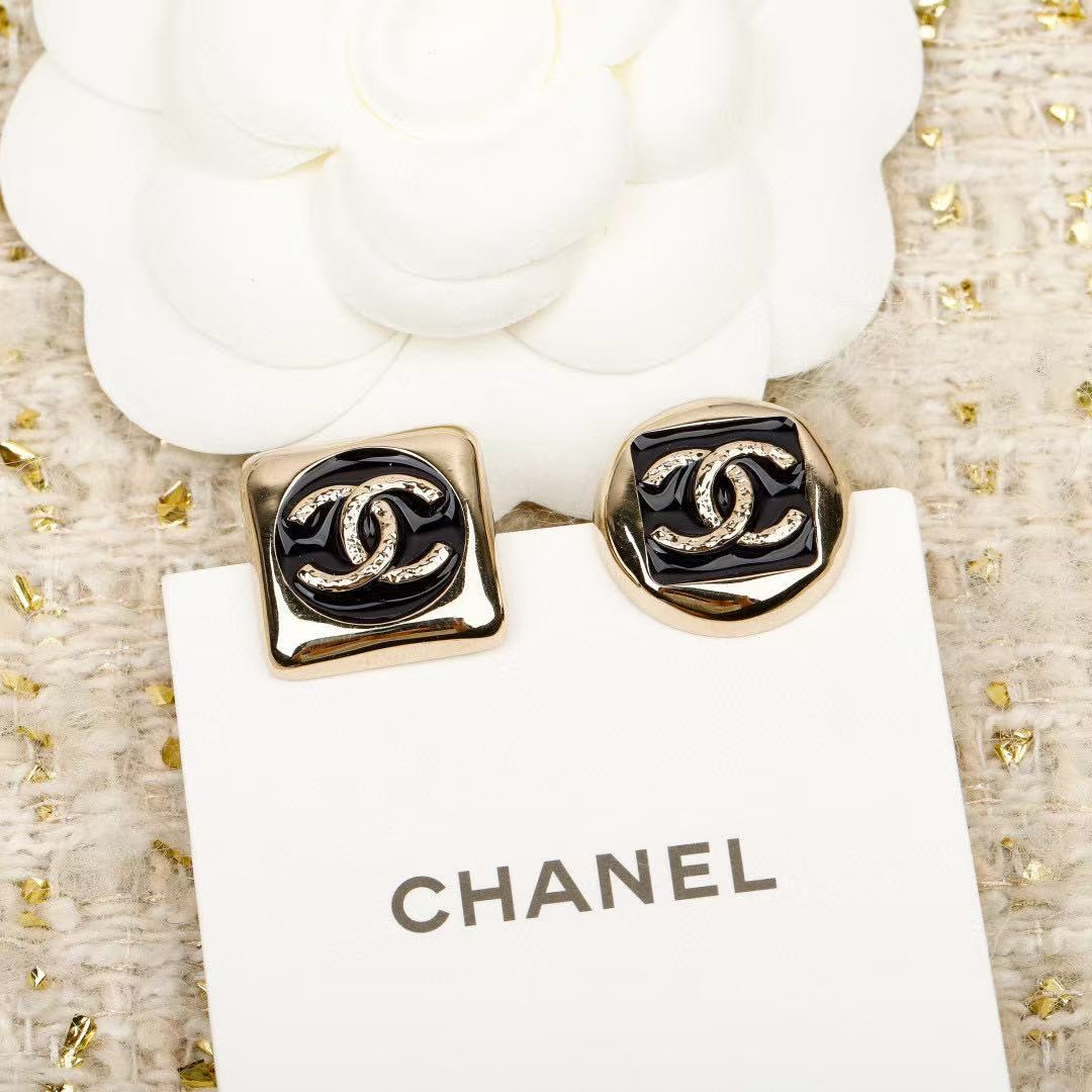 Martin Graham stud earrings in polished metal-tone – close-up detail