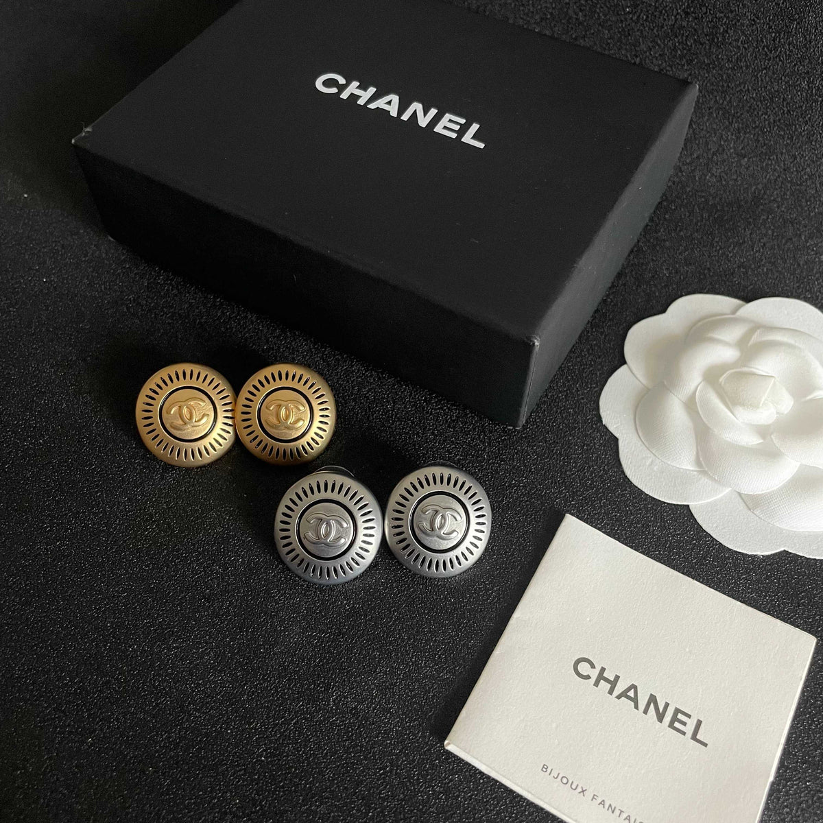 Martin Graham stud earrings in polished metal-tone – close-up detail