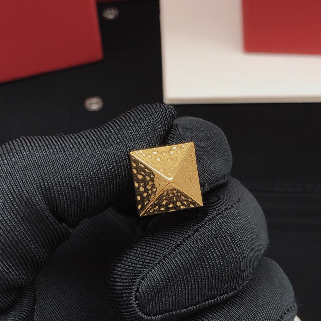 Martin Graham stud earrings in polished metal-tone
