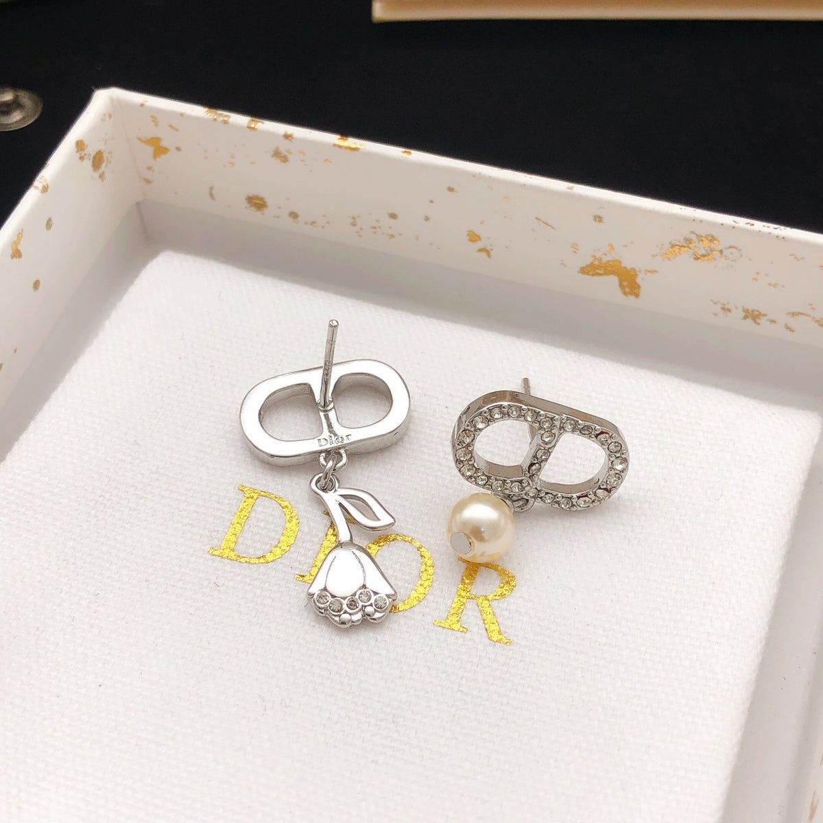 Martin Graham stud earrings in polished metal-tone