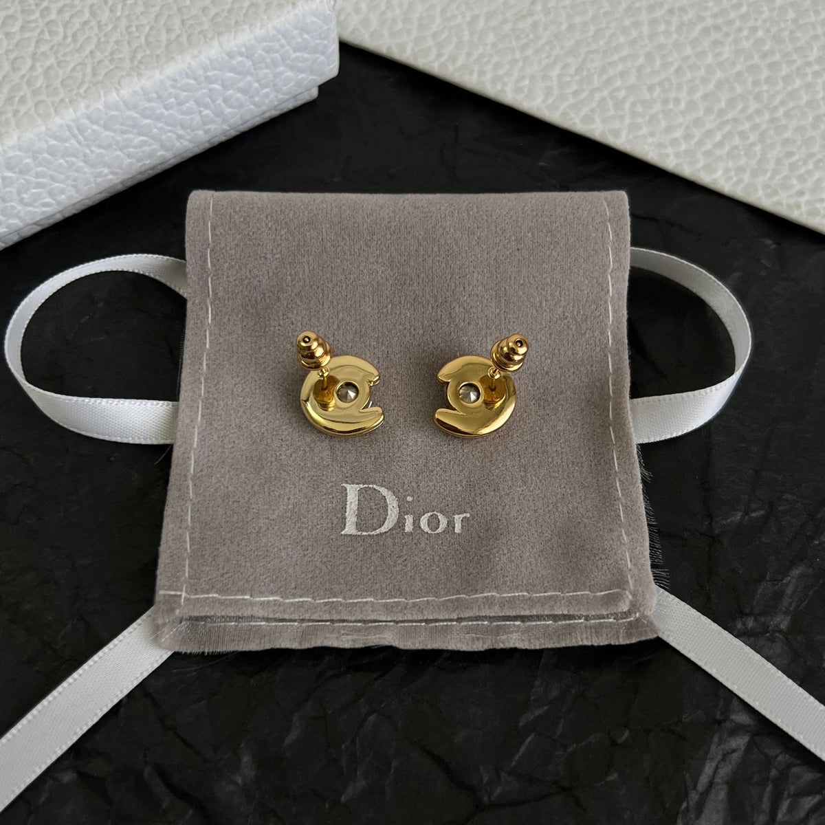 Martin Graham stud earrings in polished metal-tone