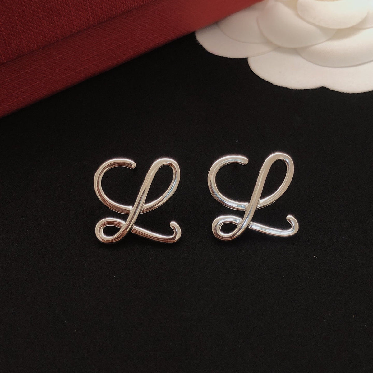 Martin Graham stud earrings in polished metal-tone