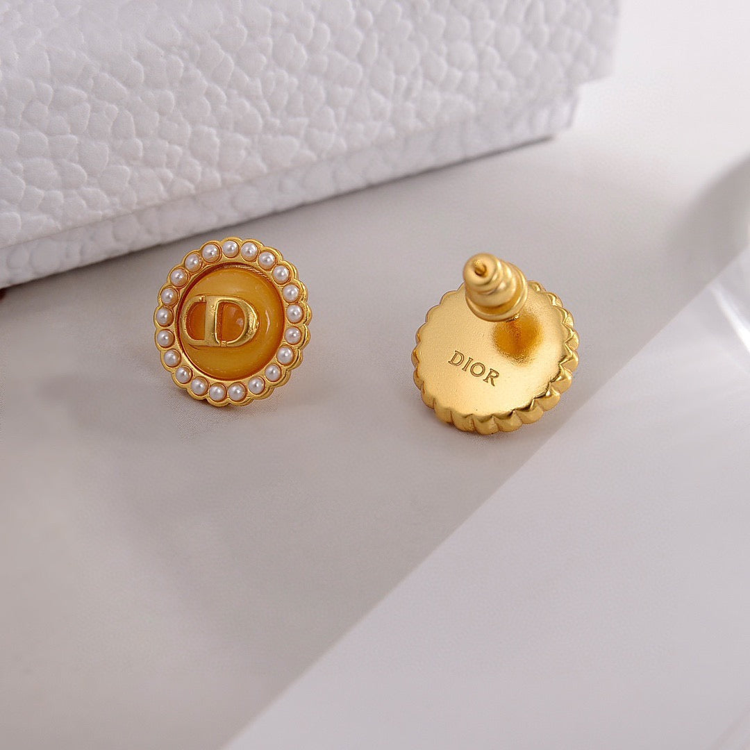 Martin Graham stud earrings in polished metal-tone