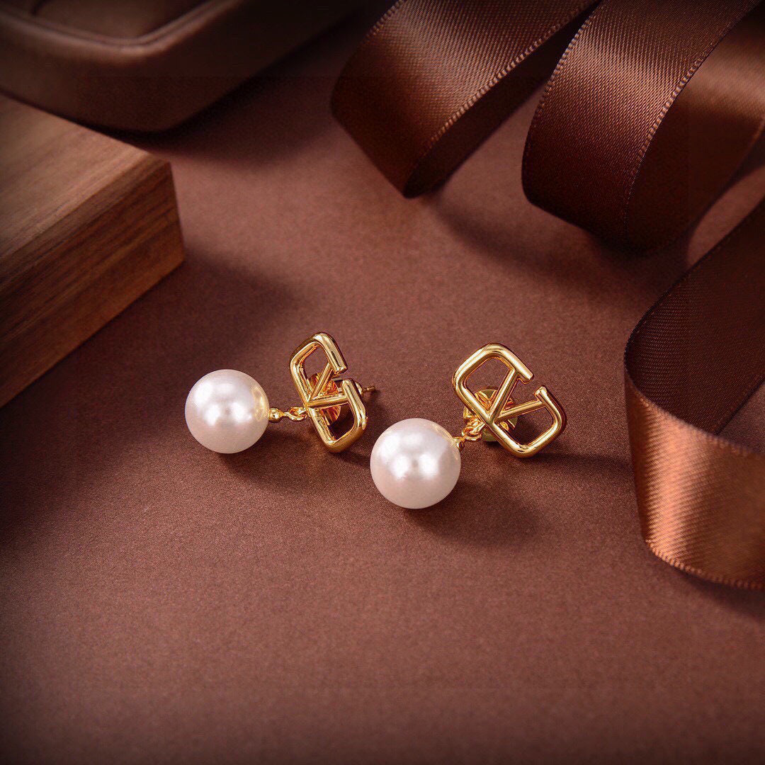 Martin Graham stud earrings in polished metal-tone