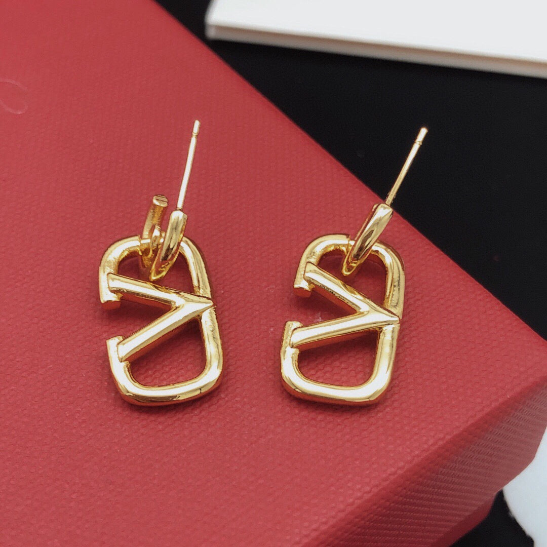 Martin Graham drop earrings in polished metal-tone
