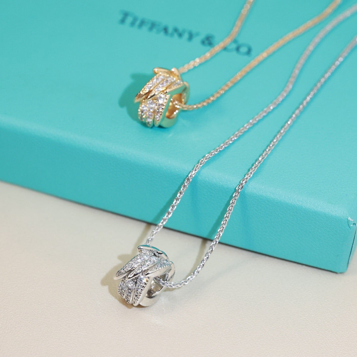 Martin Graham pendant necklace in polished metal-tone – close-up detail