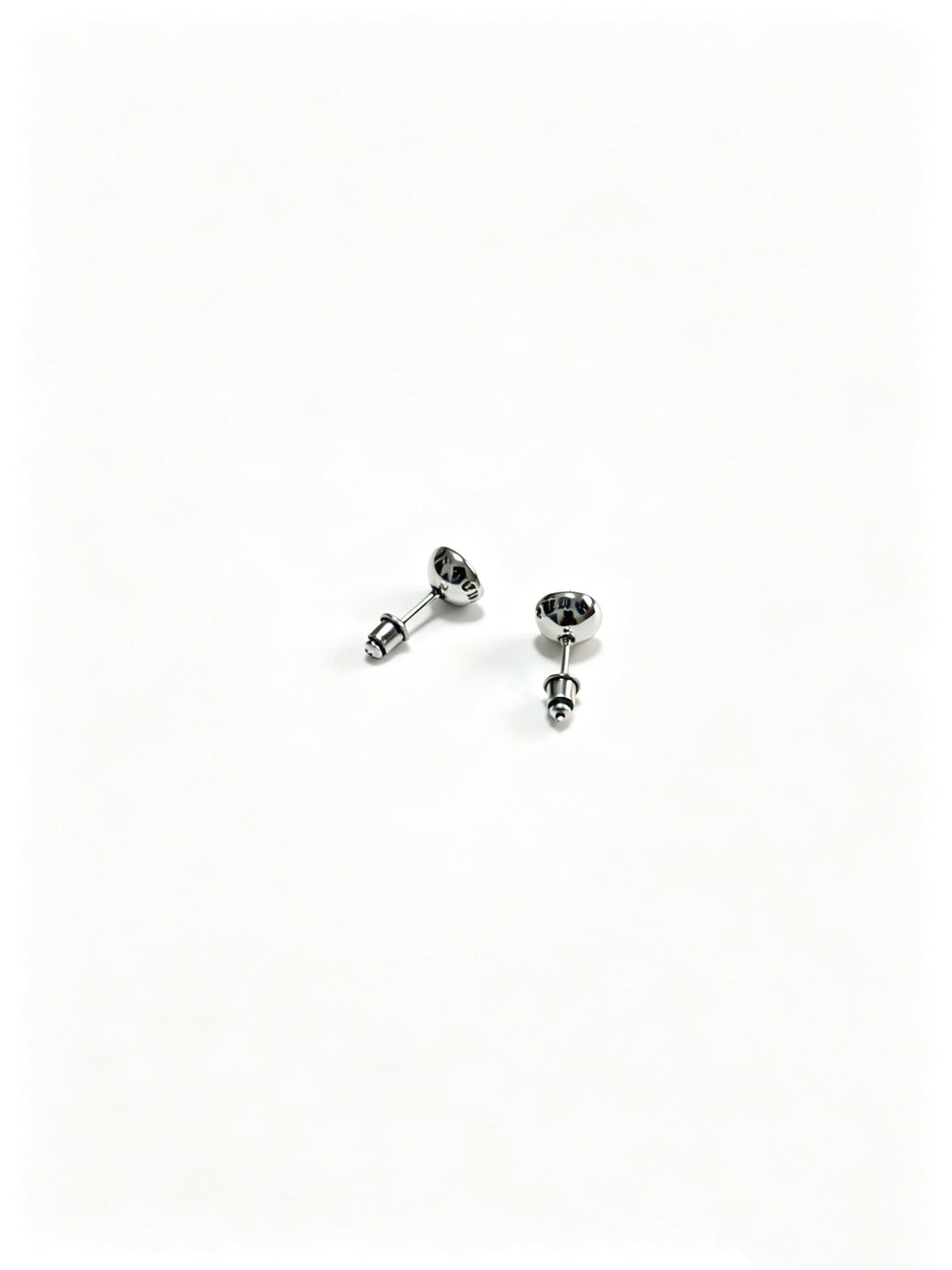 Martin Graham earrings in polished metal-tone – close-up detail