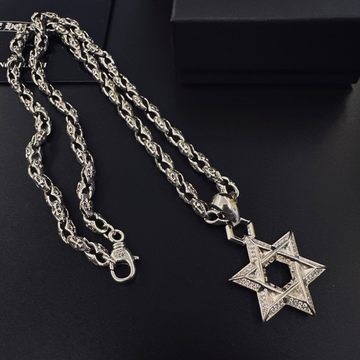 Martin Graham pendant necklace in polished metal-tone – close-up detail