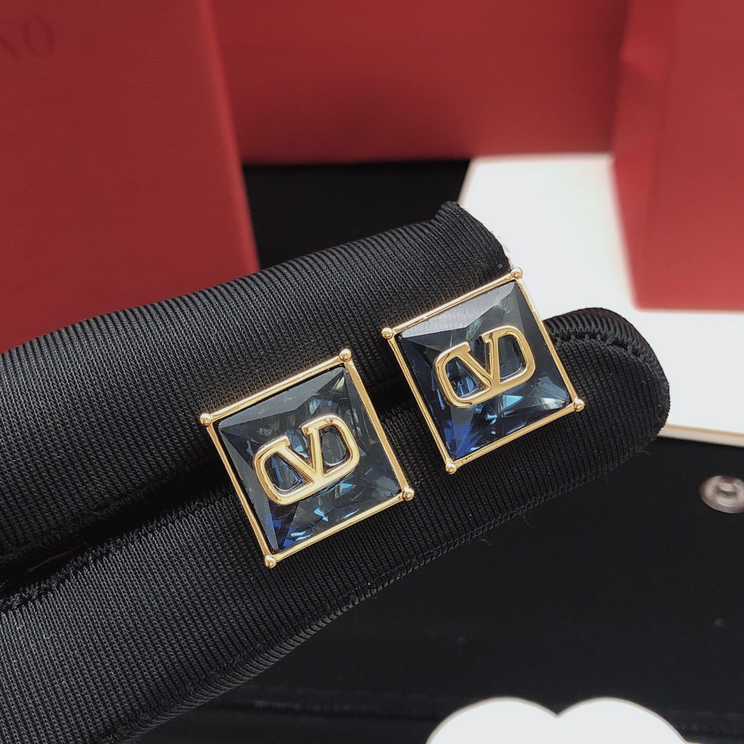 Martin Graham stud earrings in polished metal-tone