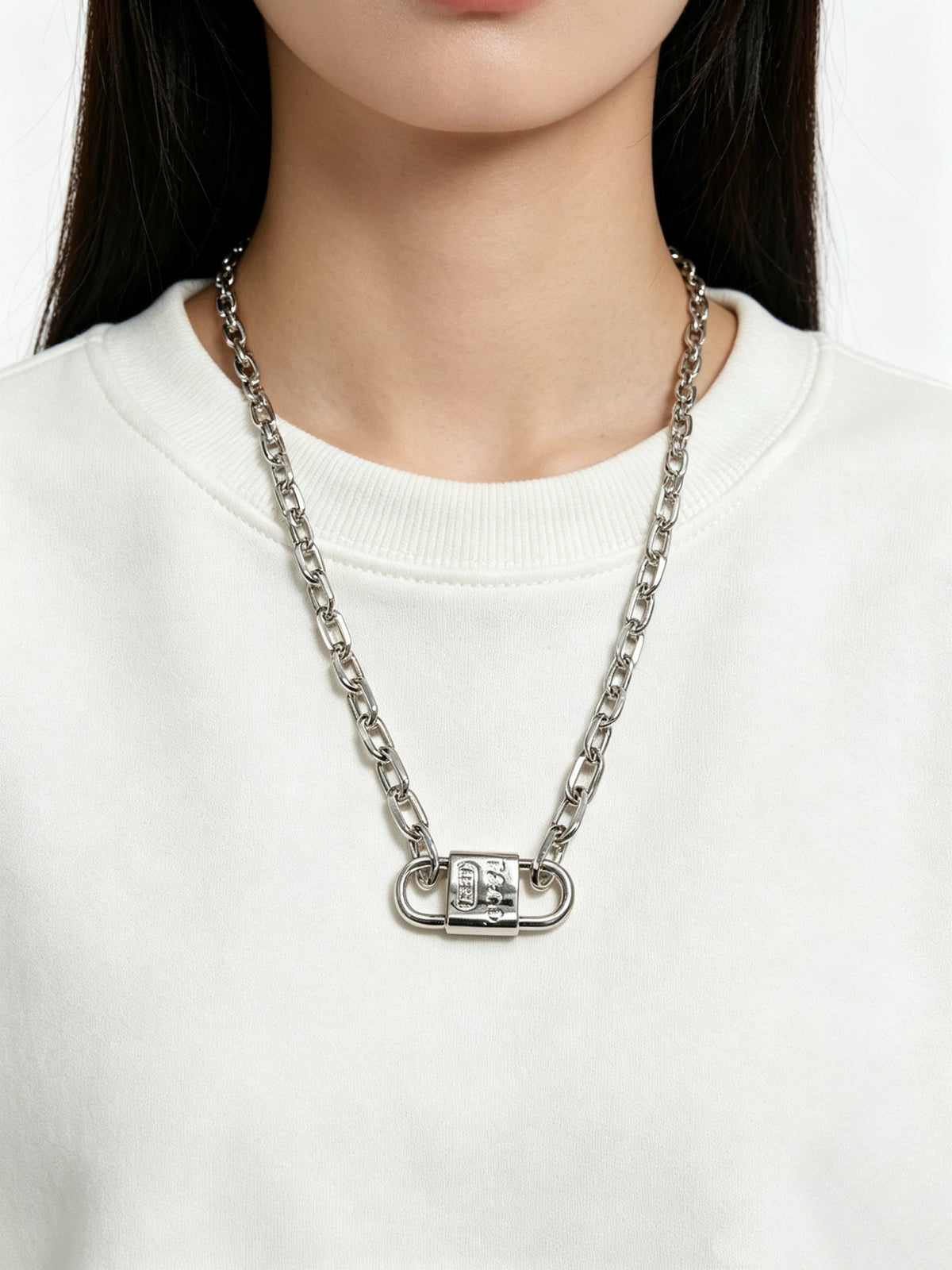 Martin Graham pendant necklace in polished metal-tone – close-up detail
