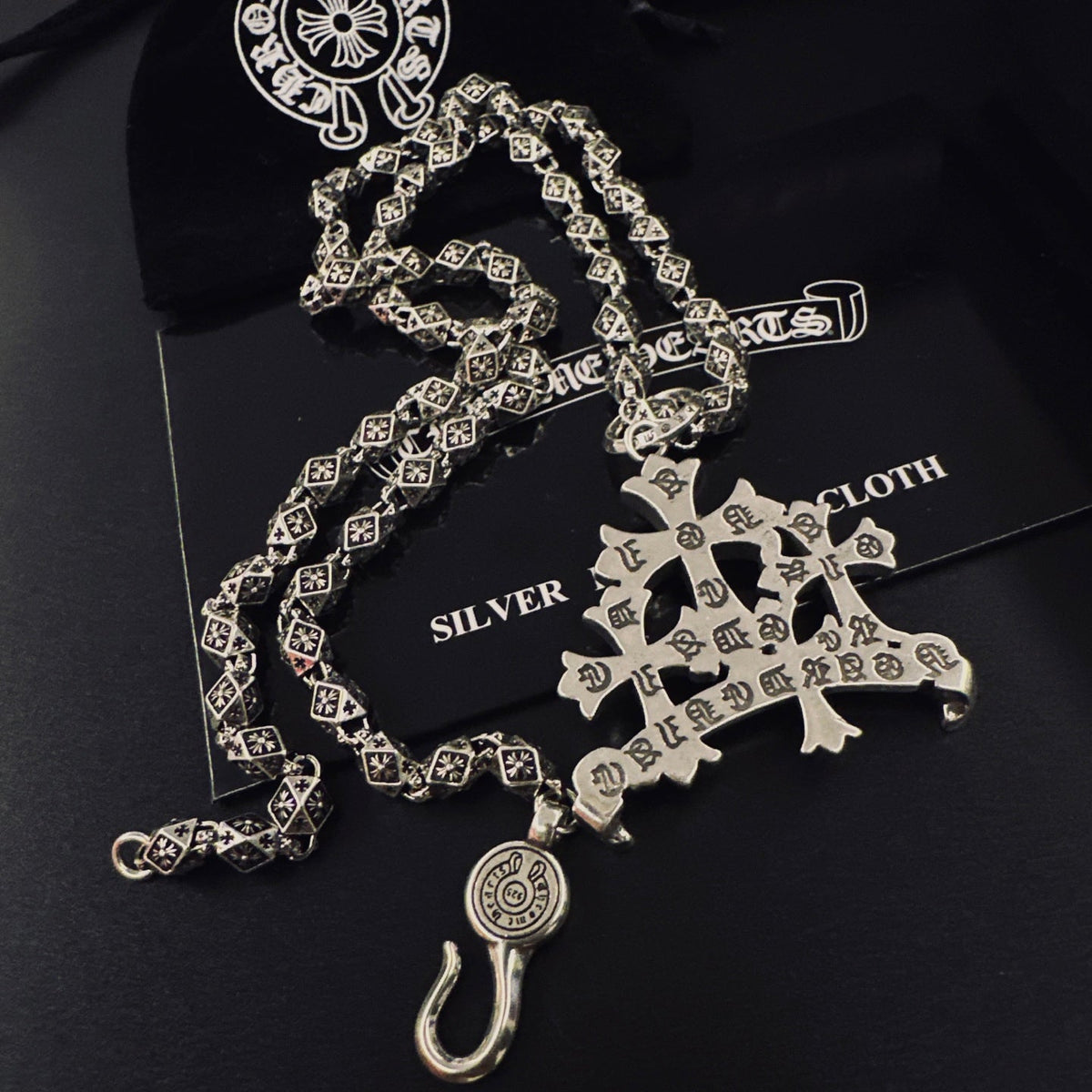 Martin Graham pendant necklace in polished metal-tone – close-up detail