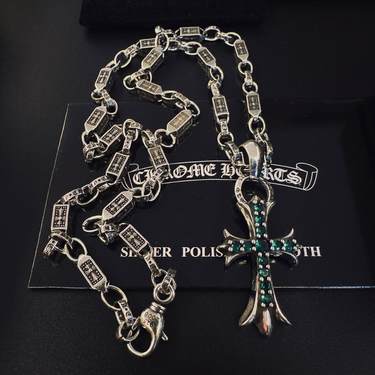 Martin Graham pendant necklace in polished metal-tone – close-up detail